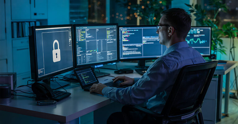 it professional working cybersecurity dark office setting